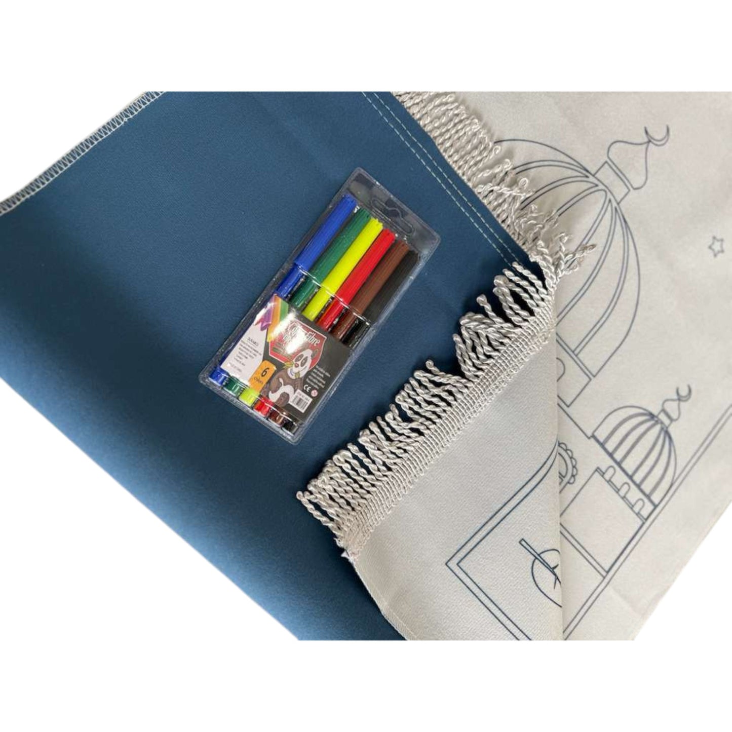 Coloring book with markers on a blue mat and white surface with designs.